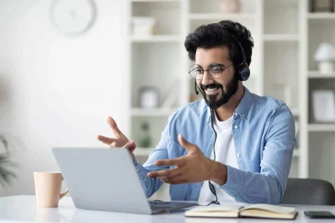 online-coaching-indian-male-tutor-making-video-call-with-laptop-headset-scaled-1-1-1-1-480x320